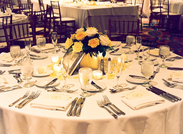 All of the guests' tables featured the centerpieces along with rose petals