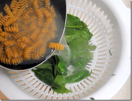 pouring water over spinach