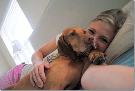 cuddling dog