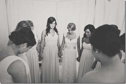 Bridesmaids Praying together before ceremony