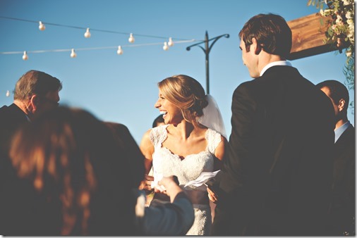 handing bride tissues at alter