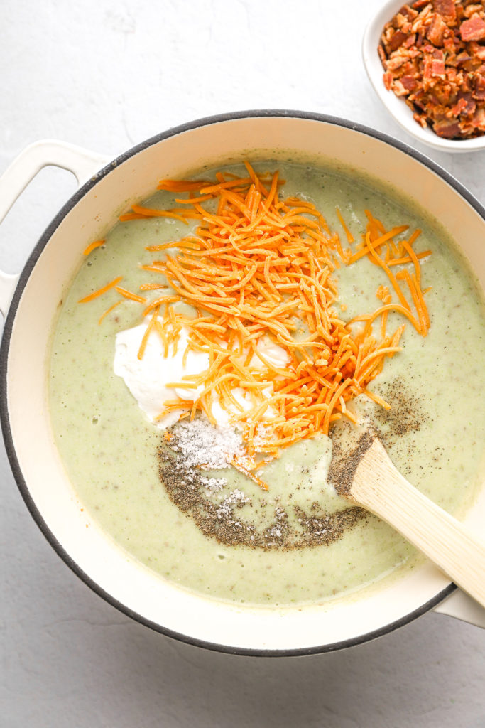 Stir in the Greek yogurt, cheddar cheese, salt and black pepper